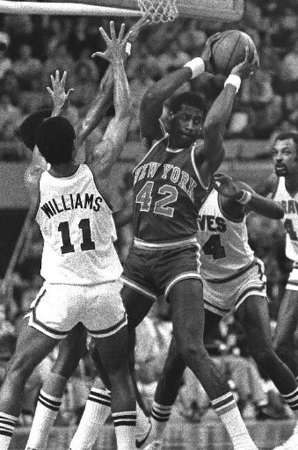 New York Knicks' Spencer Haywood (42) grabs a rebound with no help in sight as several...