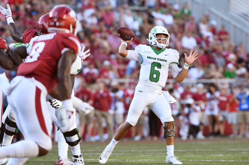 North Texas quarterback Mason Fine drops back to pass against Arkansas in the first half of...