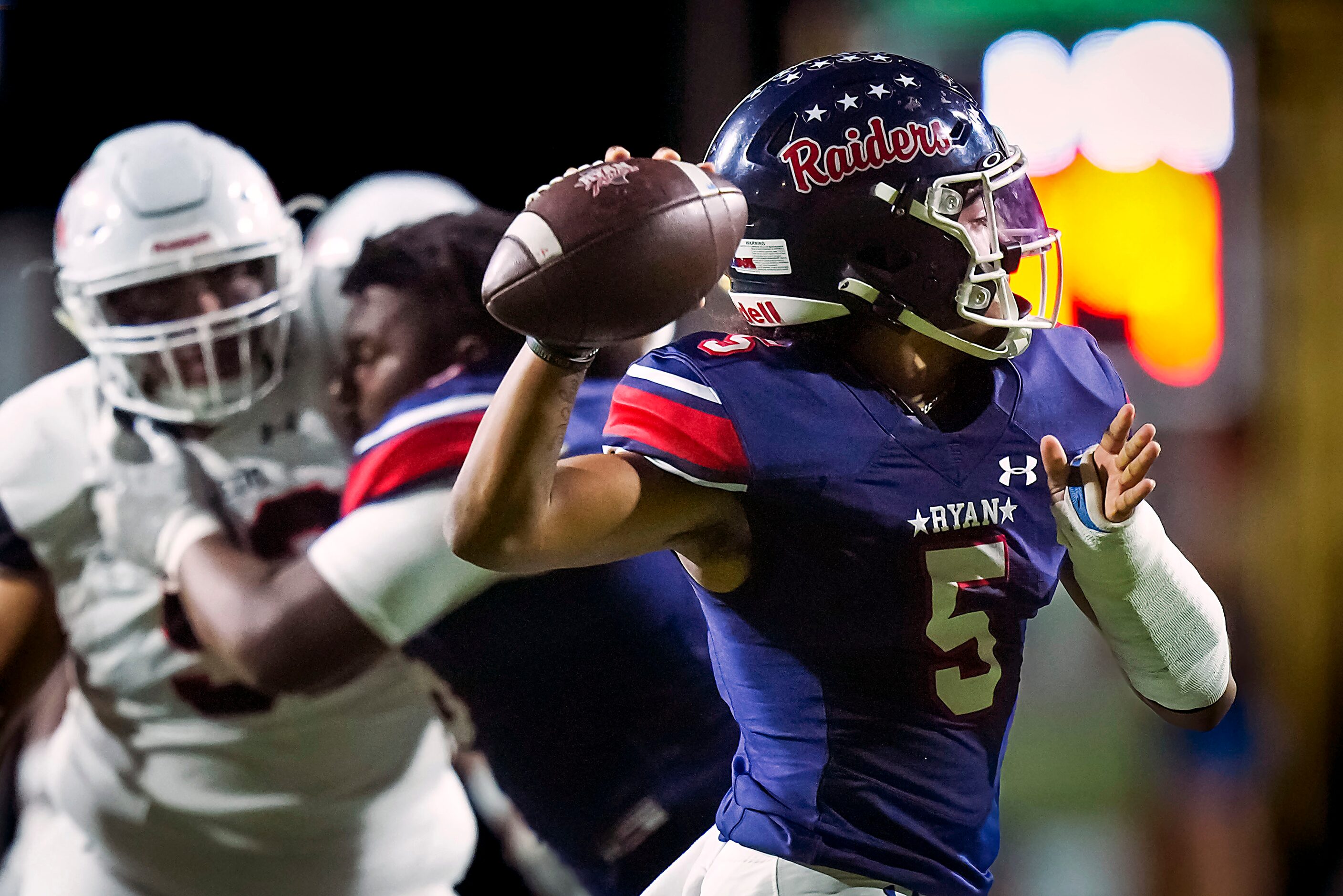 Denton Ryan quarterback Khalon Davis (5) throws a pass during the first half of a District...