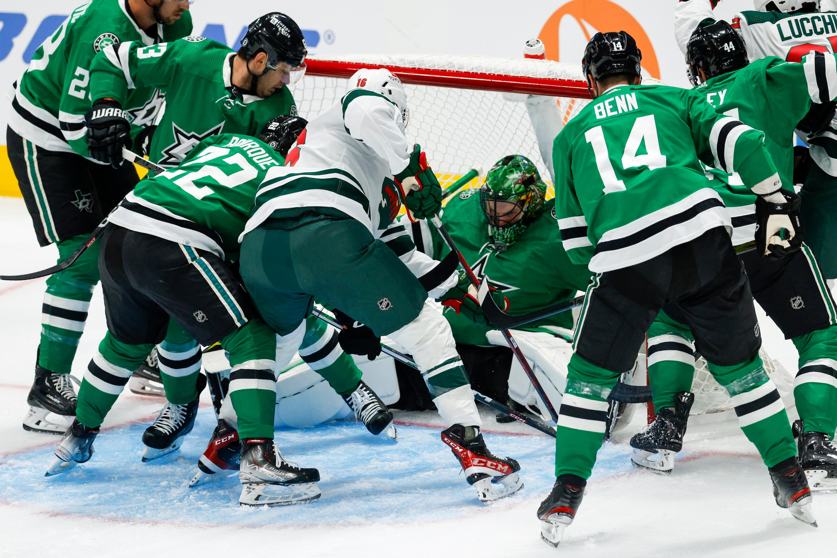 Dallas Stars goaltender Scott Wedgewood (41) falls into the goal as Minnesota Wild left wing...