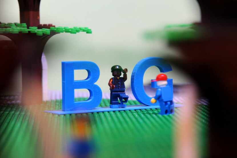 Small Lego men pose in the Dallas "BIG" letters at Cityscape at Galleria Dallas in Dallas,...
