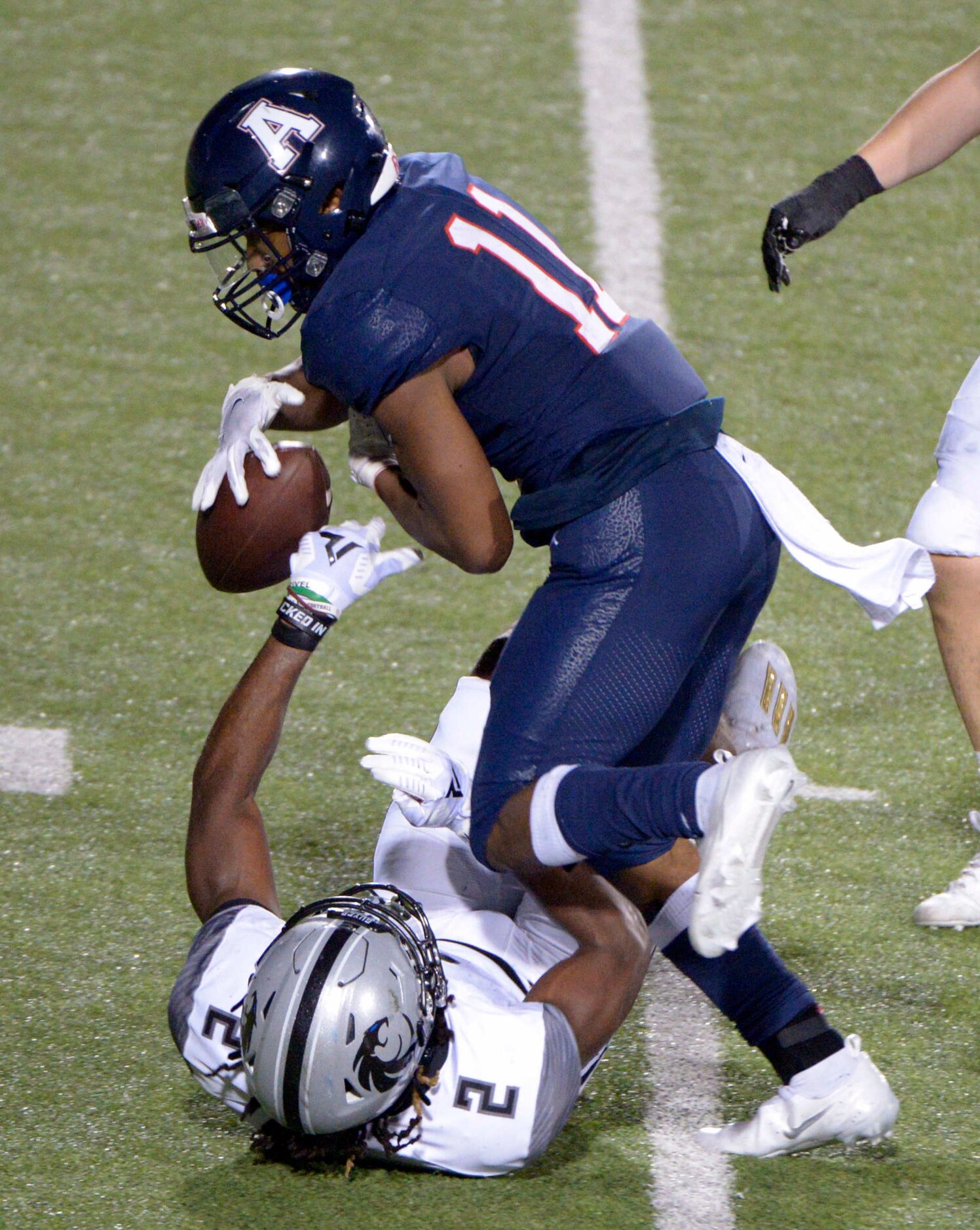 Denton Guyer’s Deuce Harmon (2) forces a fumble on a run by Allen’s Jordan Johnston (11) in...