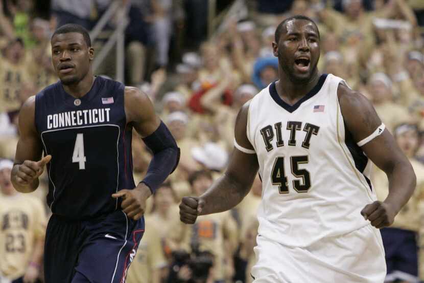 Pittsburgh's DeJuan Blair (R) celebrates in front of Connecticut's Jeff Adrian in the second...
