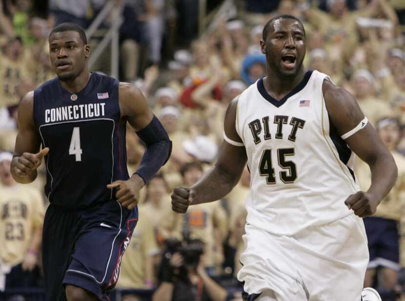 Pittsburgh's DeJuan Blair (R) celebrates in front of Connecticut's Jeff Adrian in the second...