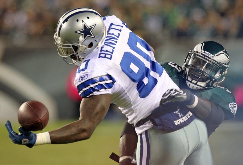 Dallas Cowboys tight end Martellus Bennett (80) tips a ball as he is tackled by Philadelphia...
