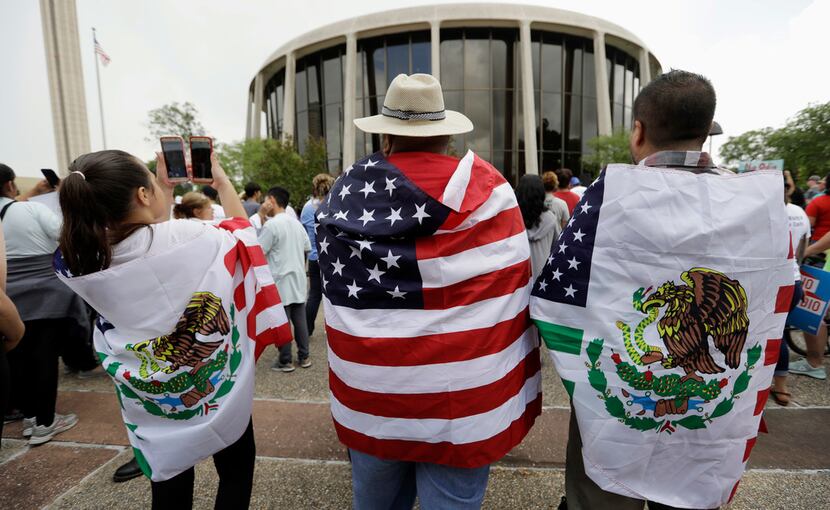Protesters rally in June outside the federal courthouse in San Antonio to oppose a new law...