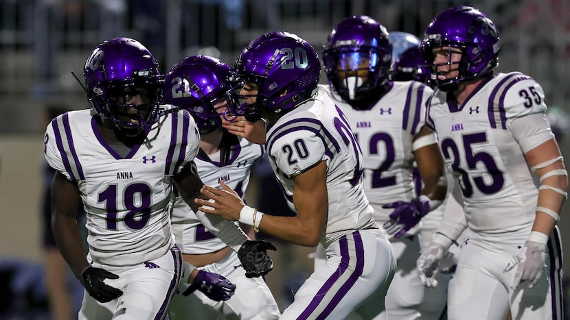 Anna defensive back Jacob Mott (18) celebrates with defensive back Nolan Galyean (20) after...