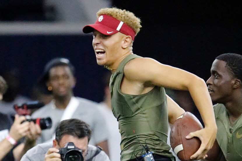 File - Quarterback Spencer Rattler celebrates a victory, winning the 7-on-7 competition at...