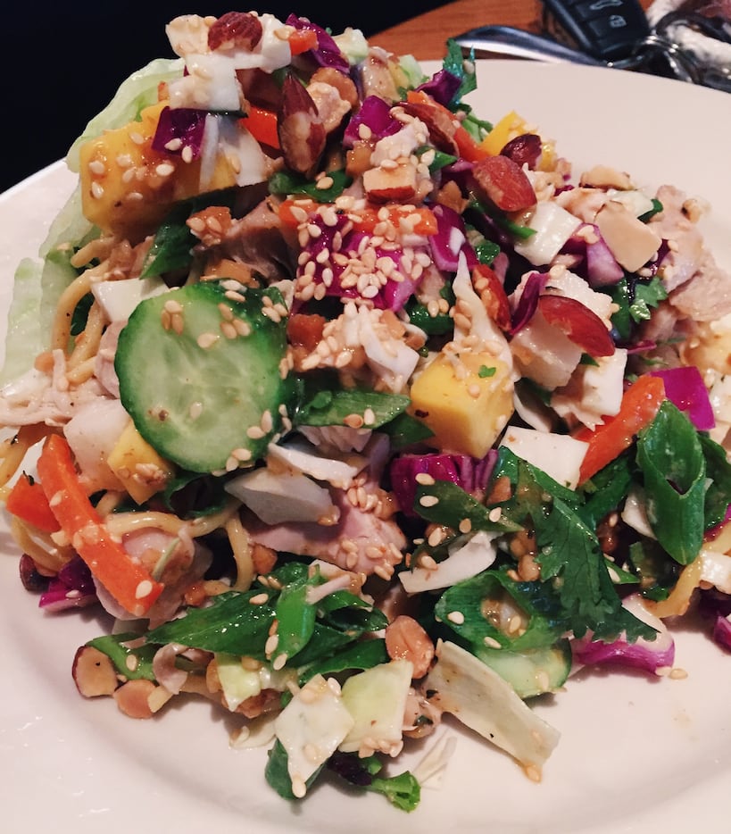 Asian Chicken & Noodle Salad is a light and protein-packed option with cucumber, mango,...