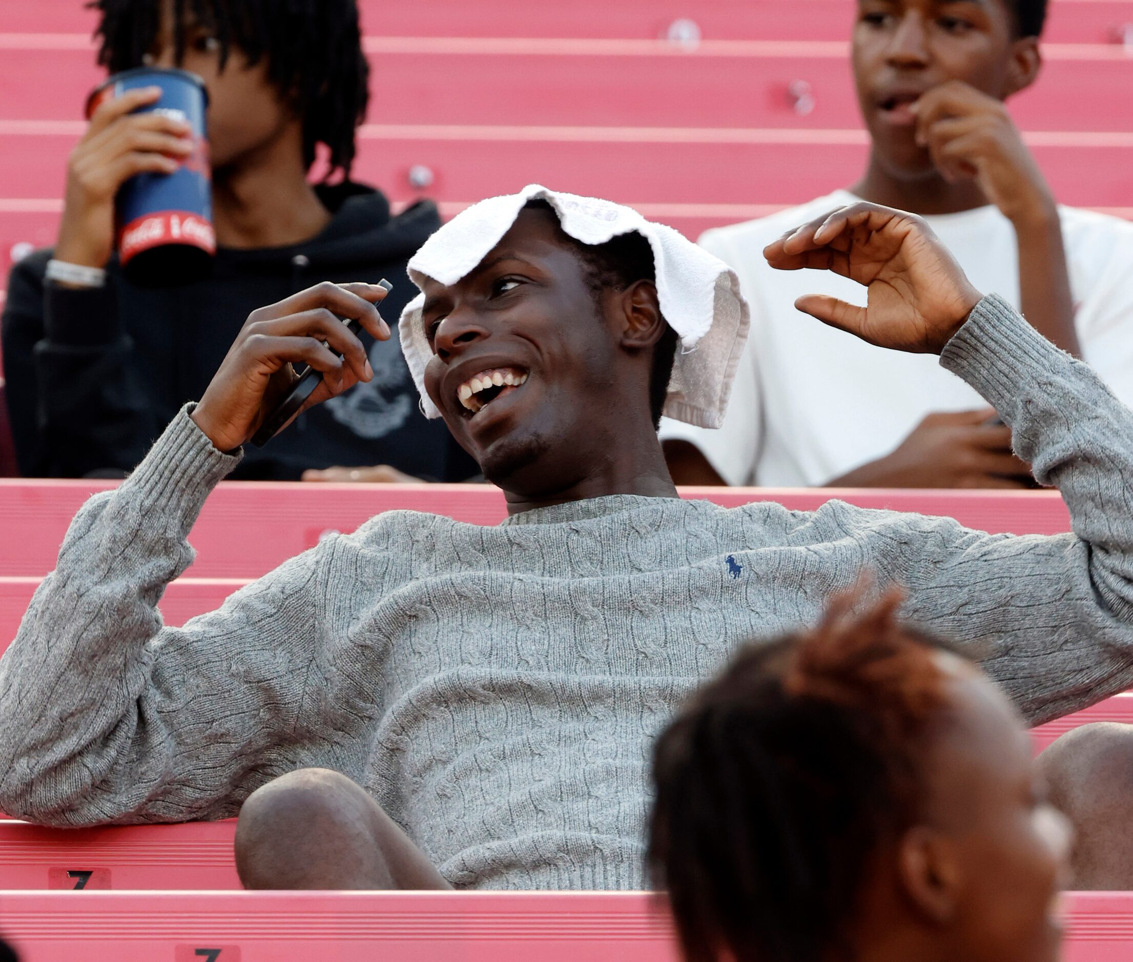 Fan Larren Bennett of Dallas tries to keep cool in the stands before Duncanville faces South...