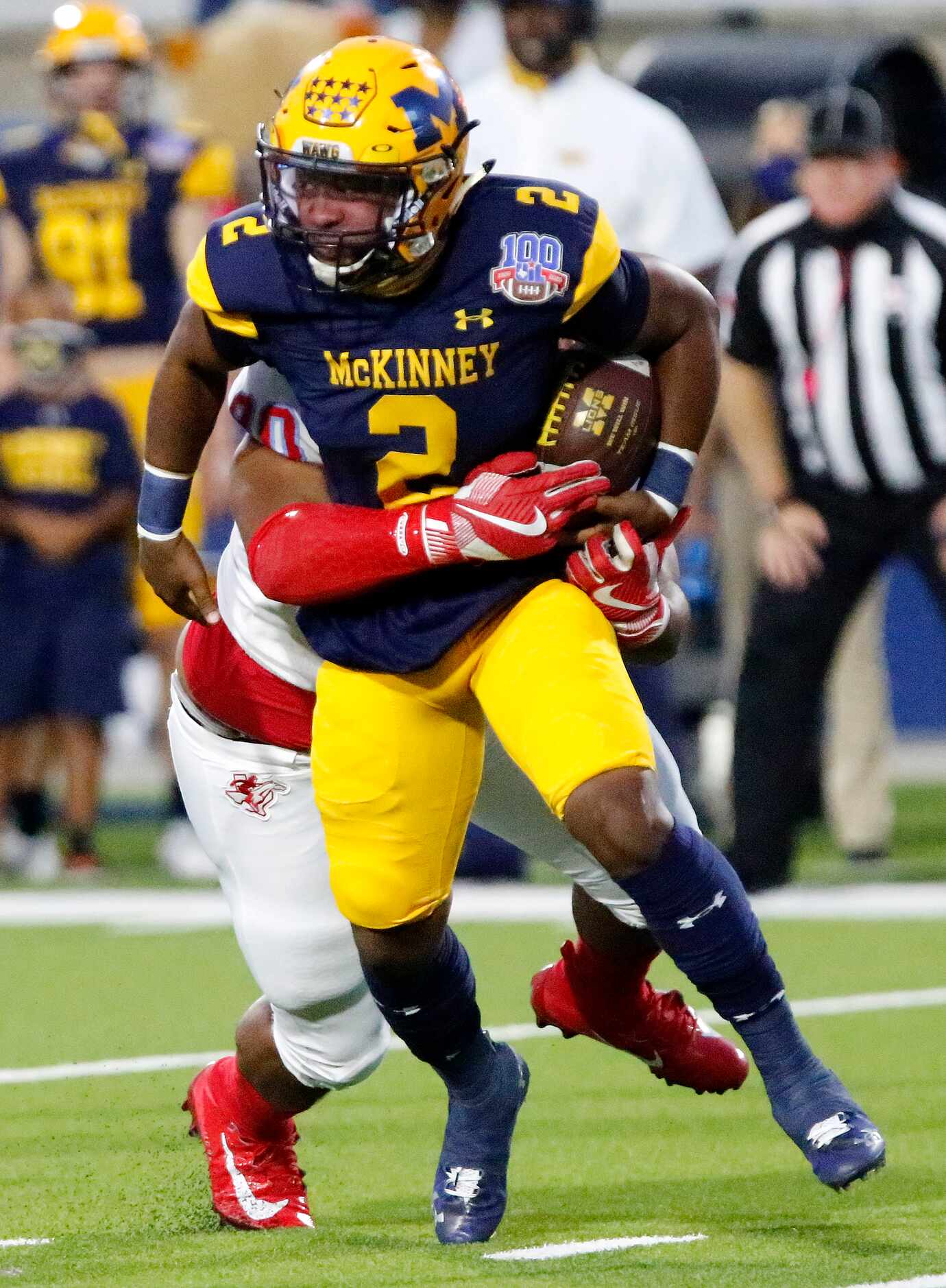 McKinney High School quarterback Ja’kobe Walton (2) was able to escape the grasp of Skyline...