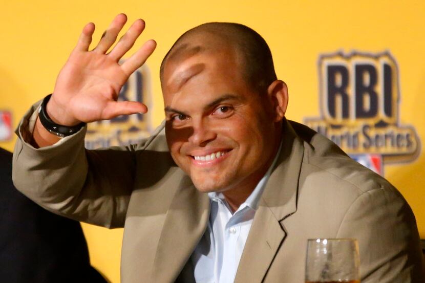 Former Texas Rangers catcher Ivan "Pudge" Rodriguez waves as he is introduced during the...