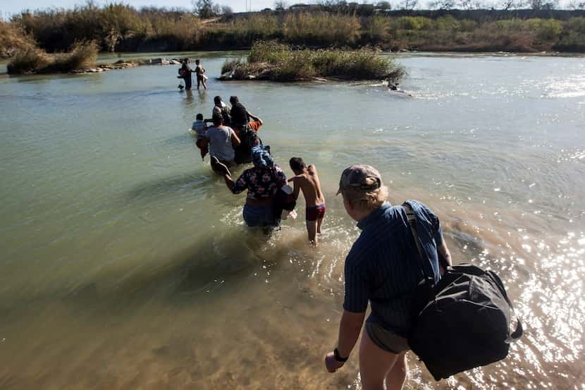 In this 2019 photo, Central American migrants try to cross the Rio Bravo from Piedras...