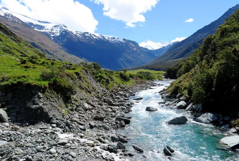 From the Rob Roy Track, hikers can glimpse Mount Aspiring behind the Matukituki River. 