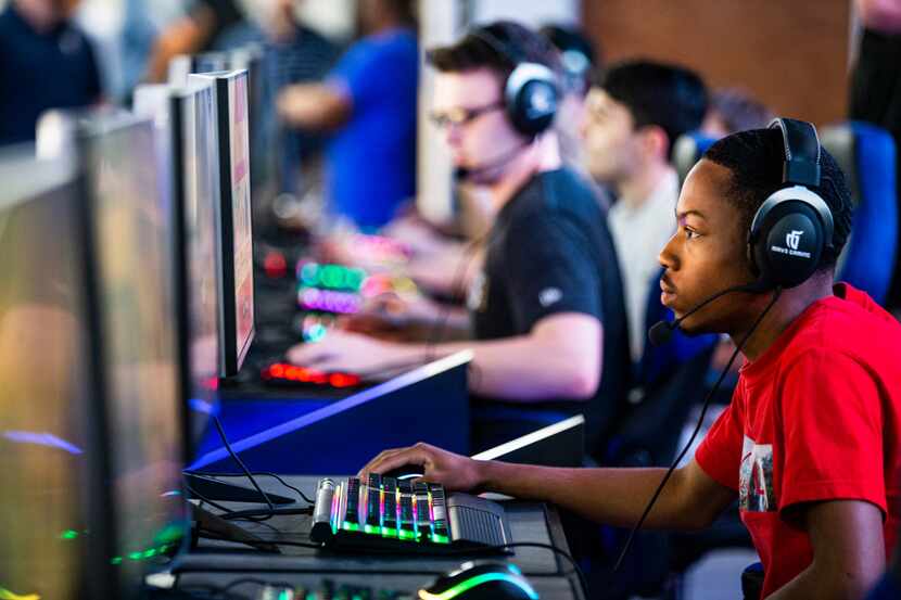 Jahlil McClure, who goes by the gamer name "Sleetys," plays a round of Fortnite during an...