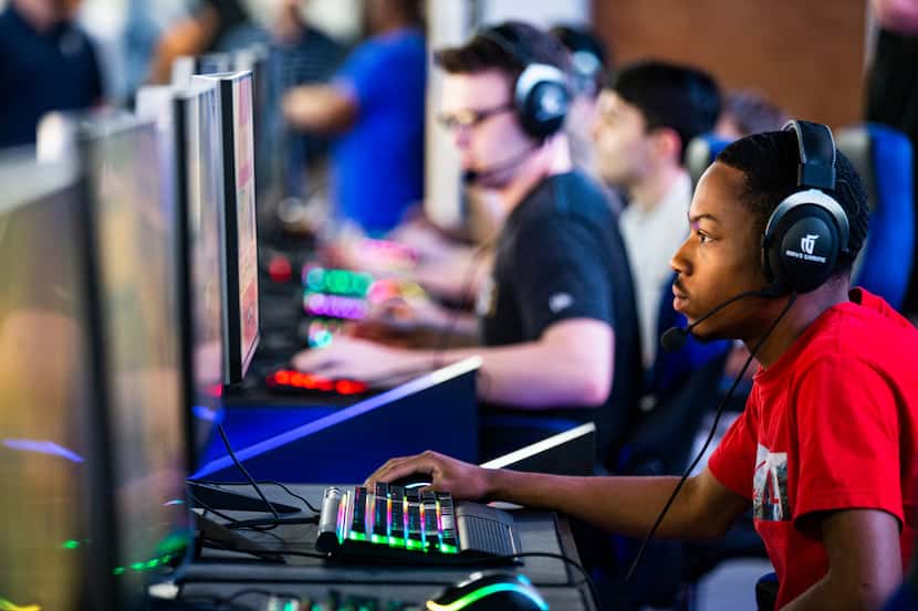 Jahlil McClure, who goes by the gamer name "Sleetys," plays a round of Fortnite during an...