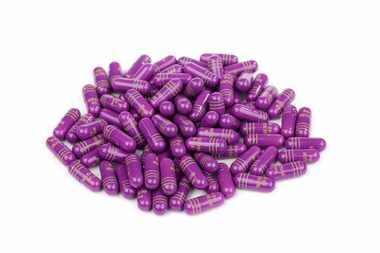 Pile of 40mg prescription Nexium pills, isolated on white. Nexium is prescribed to treat...