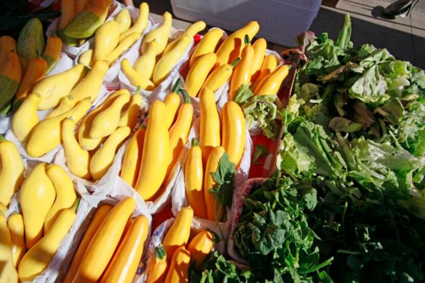 
Squash and greens on sale from Baugh Farms in Canton at the St. Michael’s Farmers Market,...