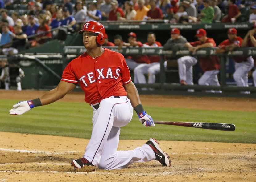 Texas third baseman Adrian Beltre loses his balance on a swing in the seventh, during an at...
