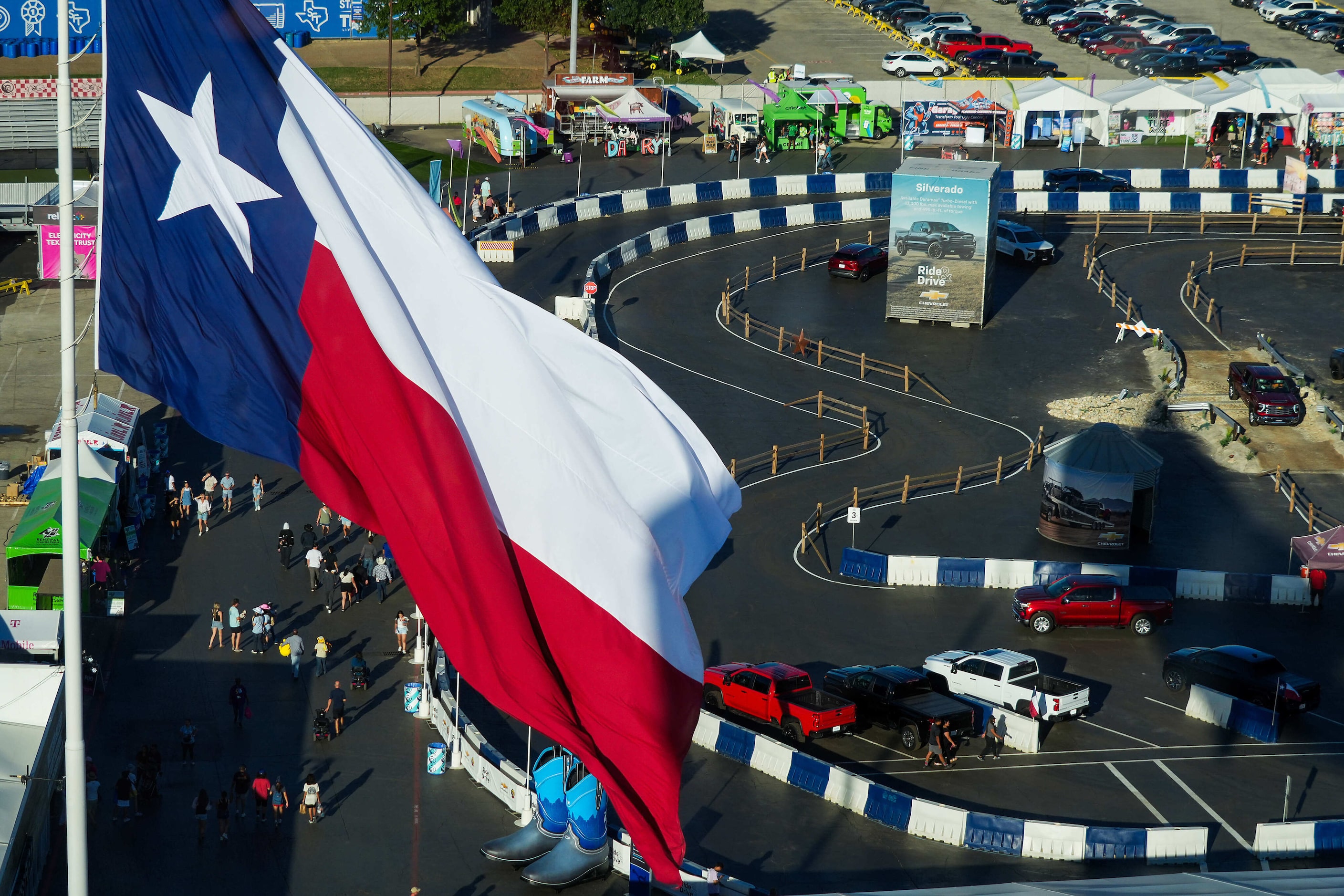 The Texas flag flies above the Chevrolet Ride and Drive test drive track at the State Fair...