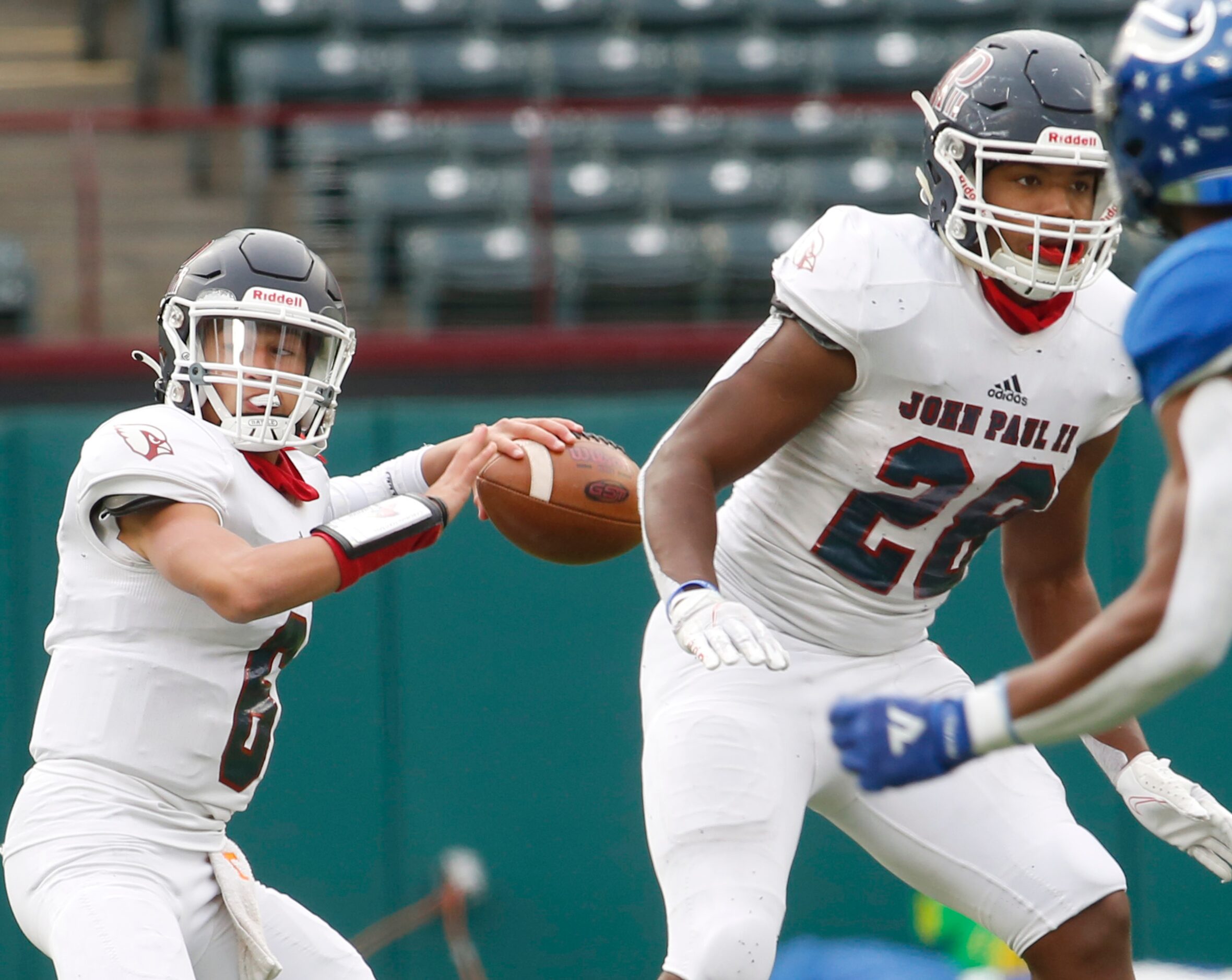 Plano John Paul ll quarterback Chase Washington (6) prepares to launch a pass downfield...