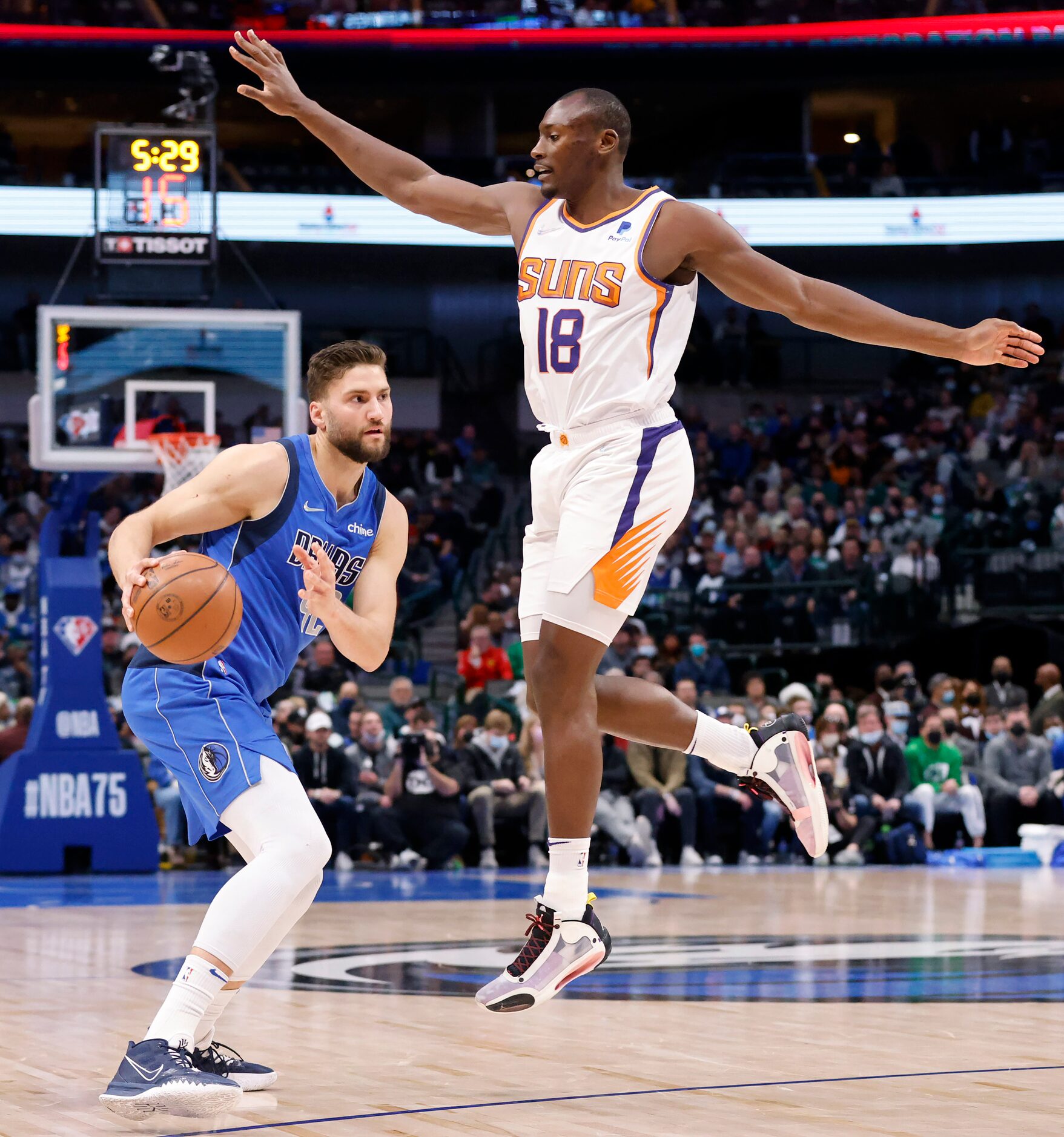 Dallas Mavericks forward Maxi Kleber (42) makes a move on Phoenix Suns Bismack Biyombo (18)...