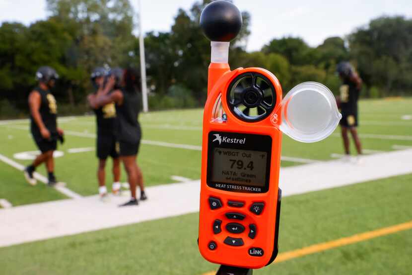 A heat stress tracker measures the temperature on the field during South Oak Cliff’s first...