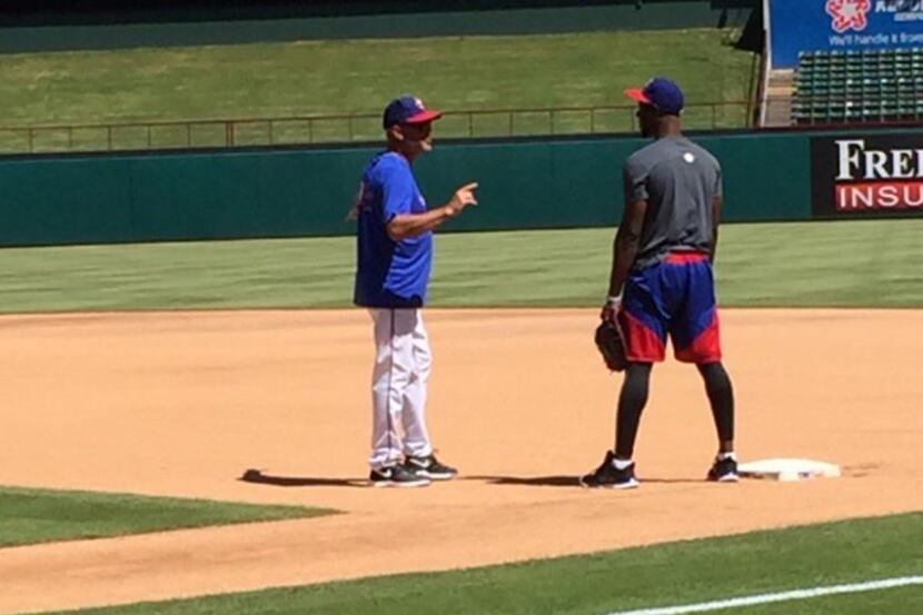 Jurickson Profar (right) was practicing fielding at first base Monday before the Rangers'...