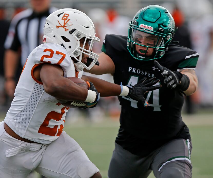 Arlington Bowie High School running back Kameron Sanders (27) tires to stiff arm Prosper...