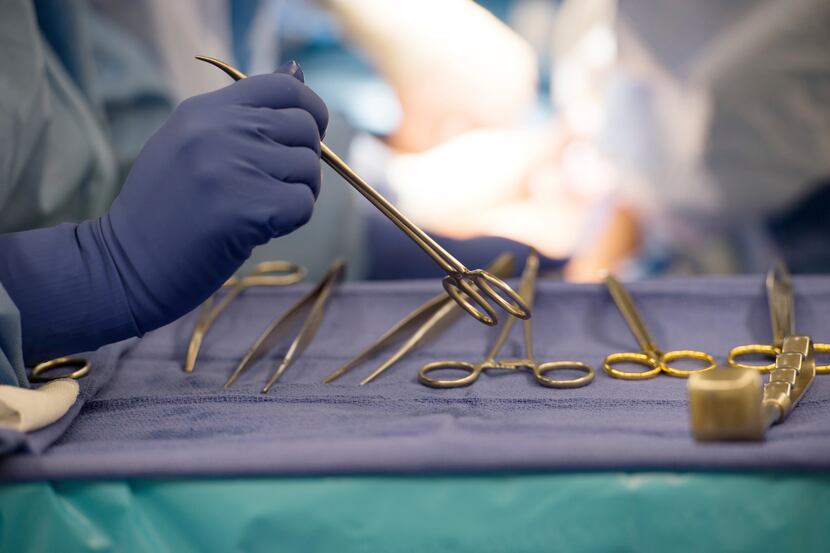 Surgical instruments are used during an organ transplant surgery at a hospital in Washington...
