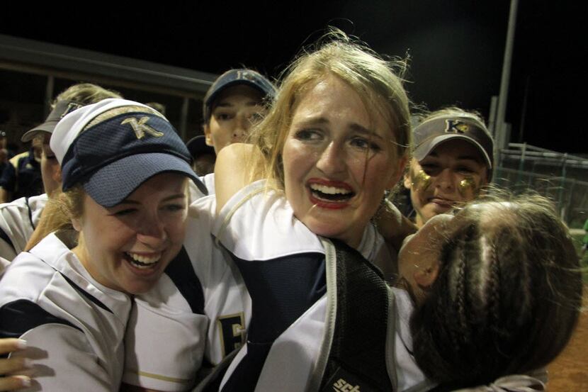 Keller pitcher Kaylee Rogers (22) is unable to hold back the tears as she is mobbed by...