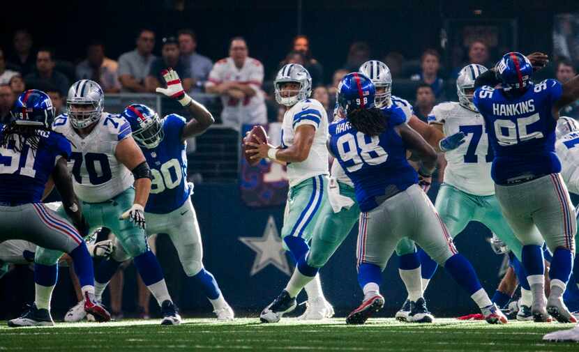 Dallas Cowboys quarterback Dak Prescott (4) looks for a receiver during the fourth quarter...