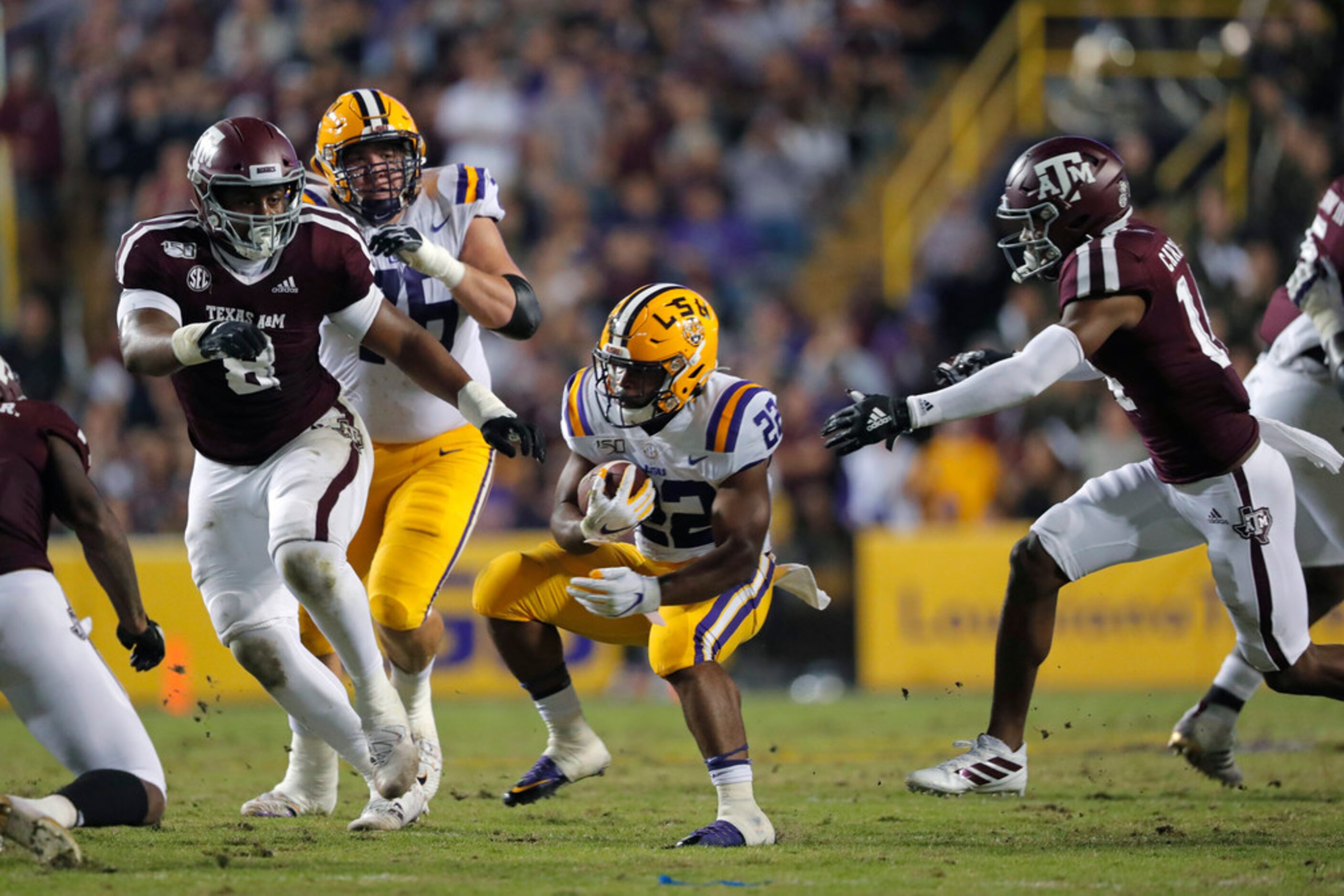 LSU running back Clyde Edwards-Helaire (22) carries in the first half of an NCAA college...