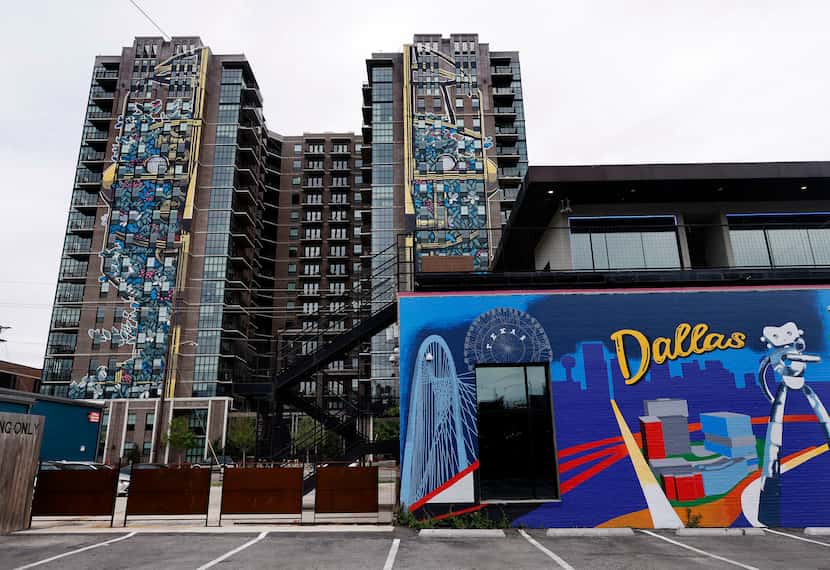 Large art murals run the length of the high-rise Case Building at 3131 Main St. in the Deep...