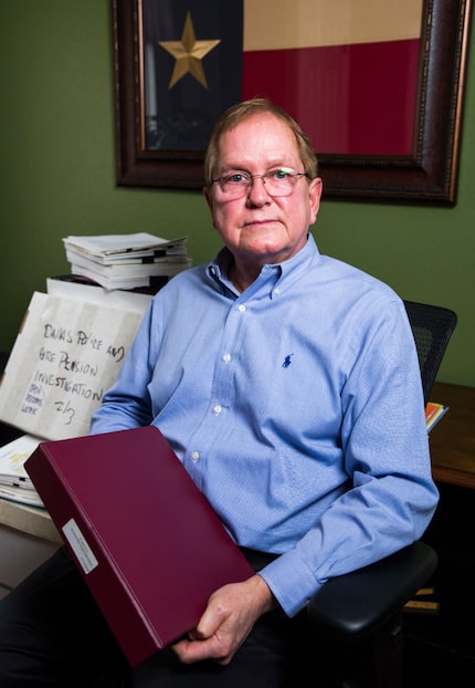 Forensic accountant Sandy Alexander poses for a portrait with boxes of files used in a...