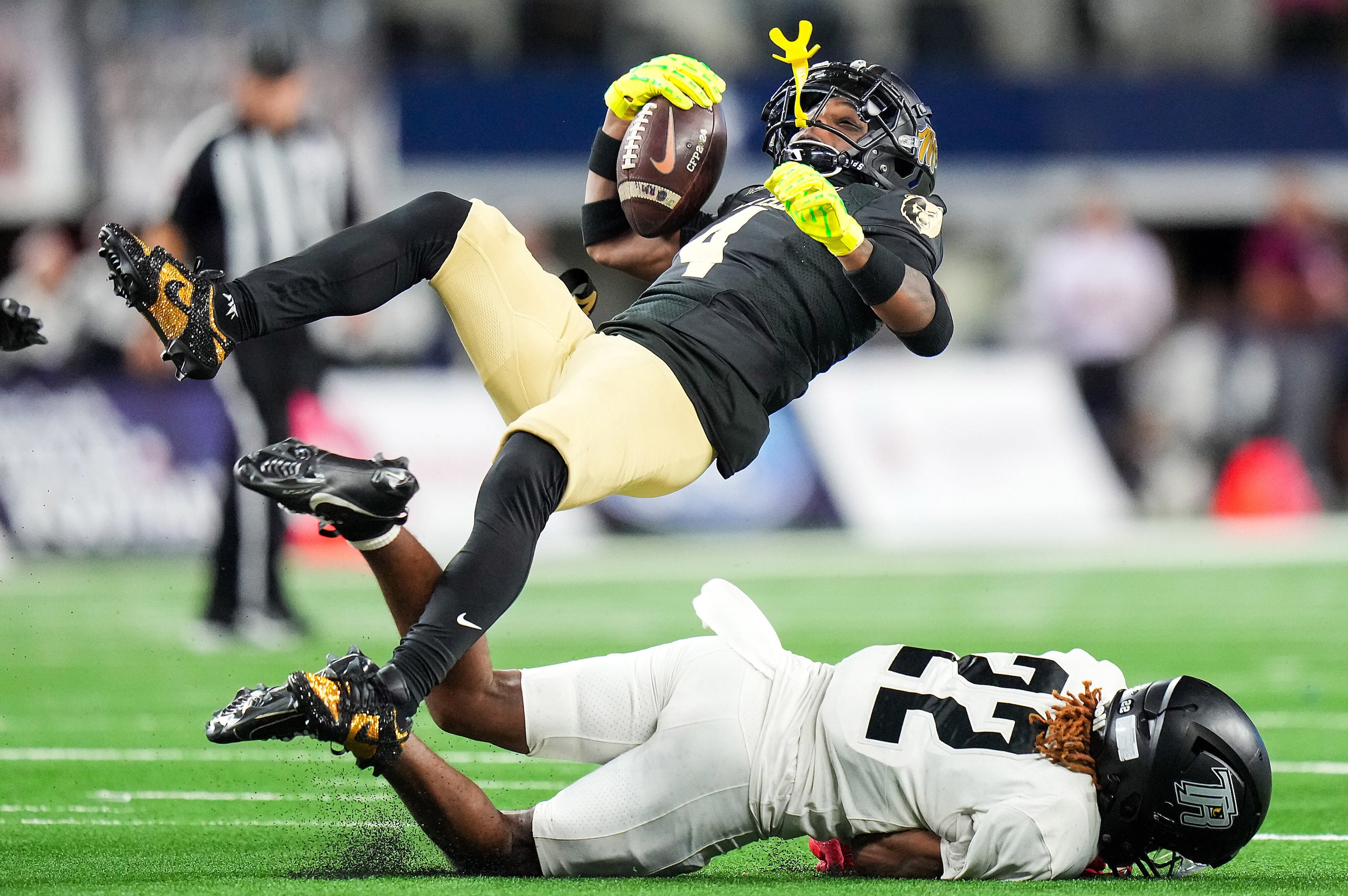 South Oak Cliff’s Levon Morton (4) is knocked off his feet by Richmond Randle’s D'Shawn...