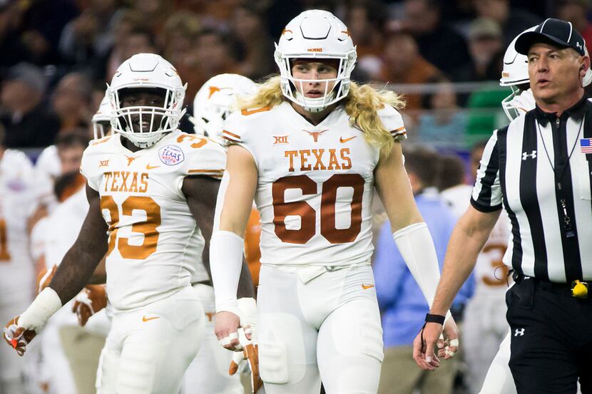Texas linebacker Breckyn Hager is pictured wearing the No. 60 to honor late Longhorns great...