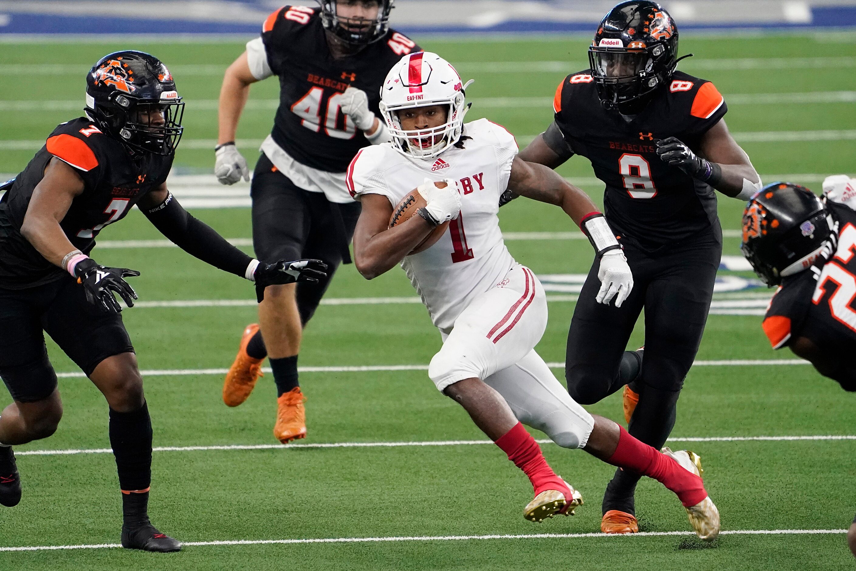 Crosby Reggie Branch (1) is pursued by Aledo linebacker Bryan Allen (7), linebacker Keenan...