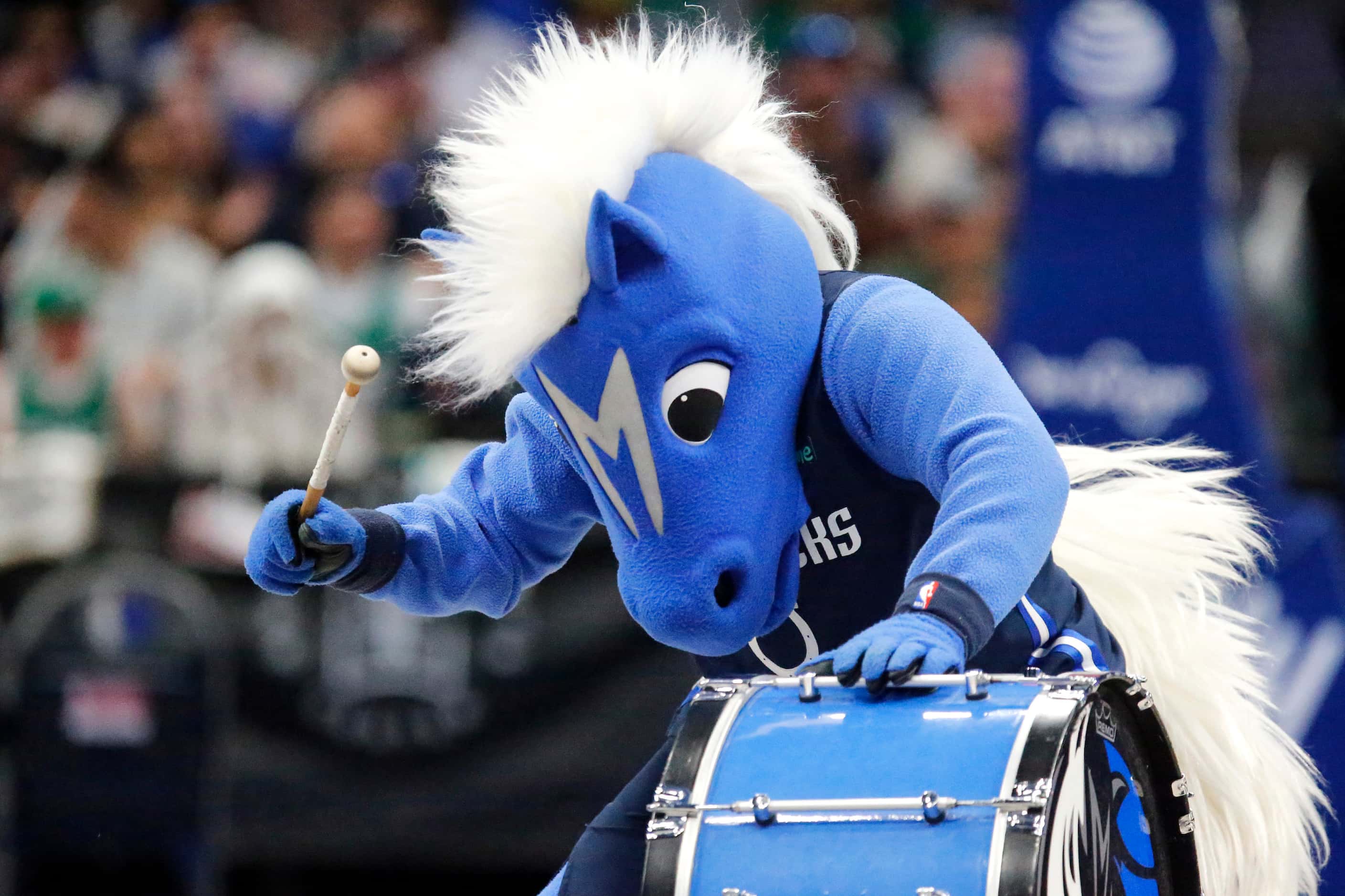 Mavericks mascot, Champ, beats the drum in anticipation of the team taking the court at the...