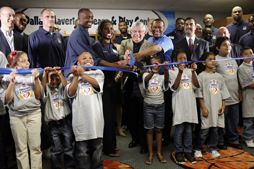 David Stern, commissioner of the NBA, is flanked by other league dignitaries and members of...