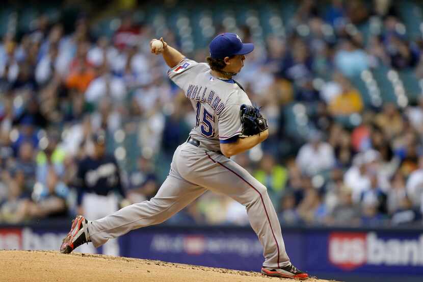 MILWAUKEE, WI - MAY 08: Derek Holland #45 of the Texas Rangers pitches in the bottom of the...
