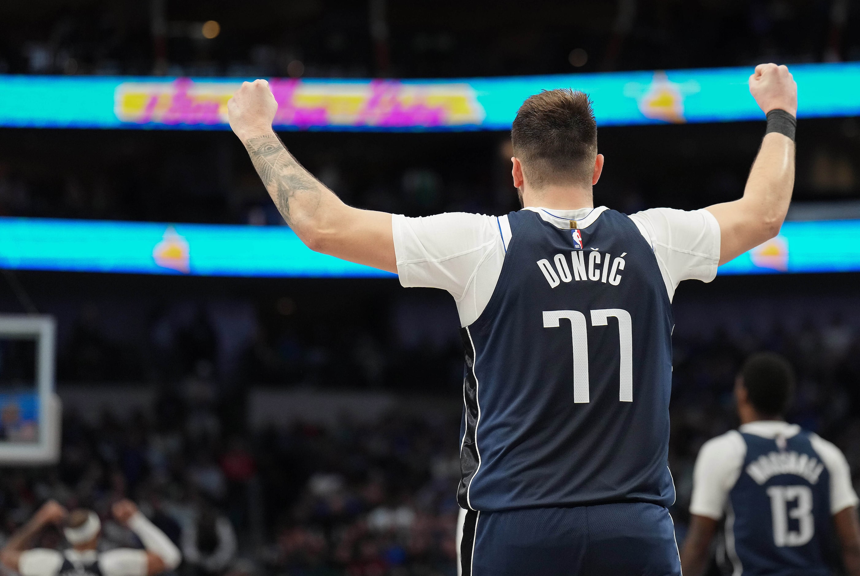 Dallas Mavericks guard Luka Doncic celebrates a Mavericks basket during the second half of...