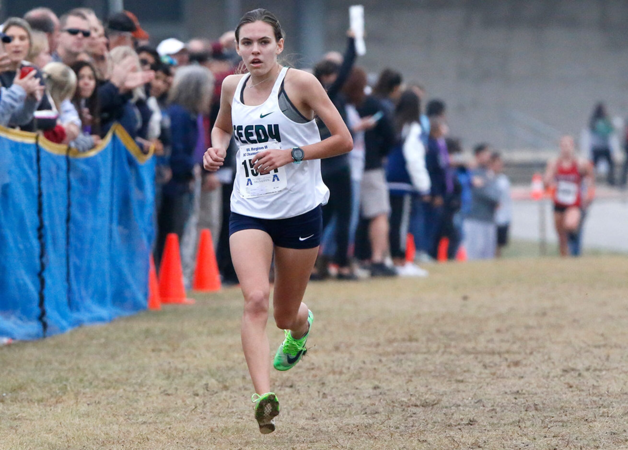 Reedy High School's Colleen Stegmann nears the finish line alone in first place at the...