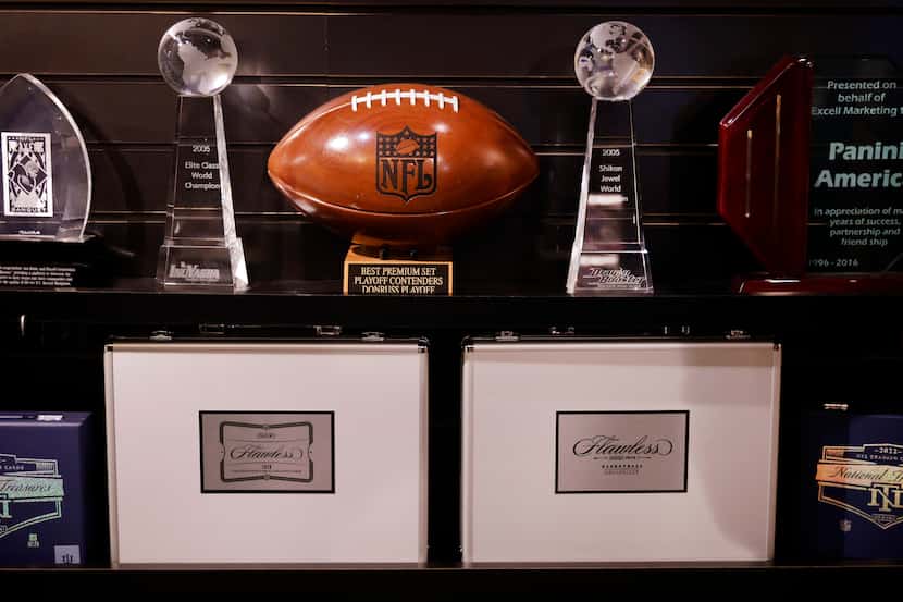 Panini America displays Flawless college football and basketball collectors cases, a product...