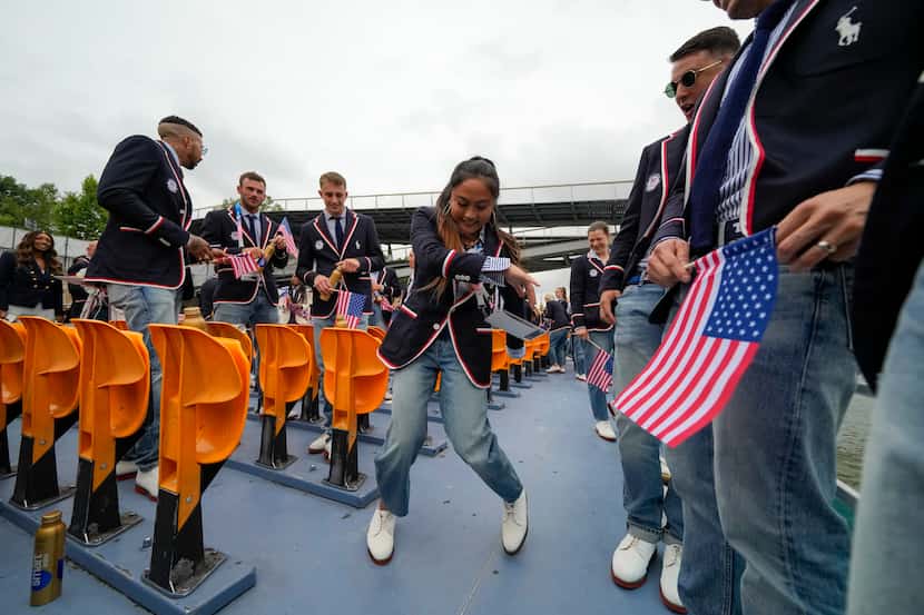 Logan Edra, of the United States breakdancing team, dances as she travels along with...