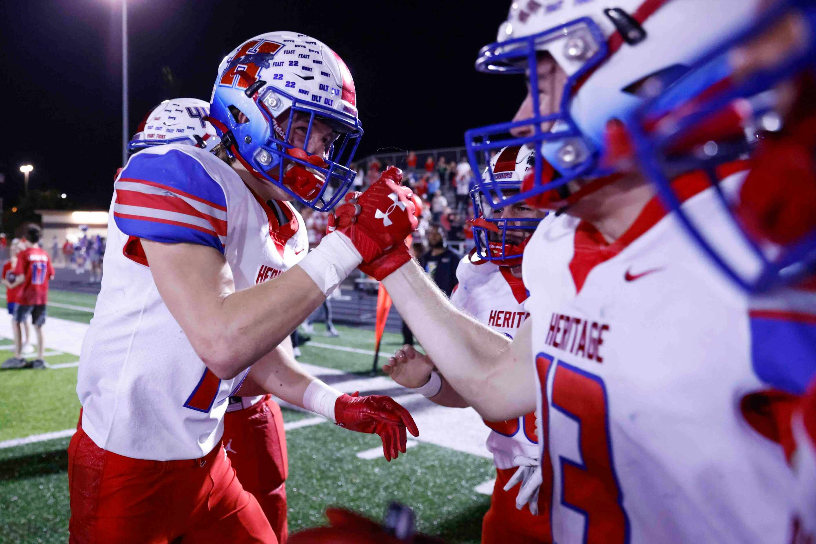 Midlothian Heritage high players celebrate after winning the district 5-5A division II title...