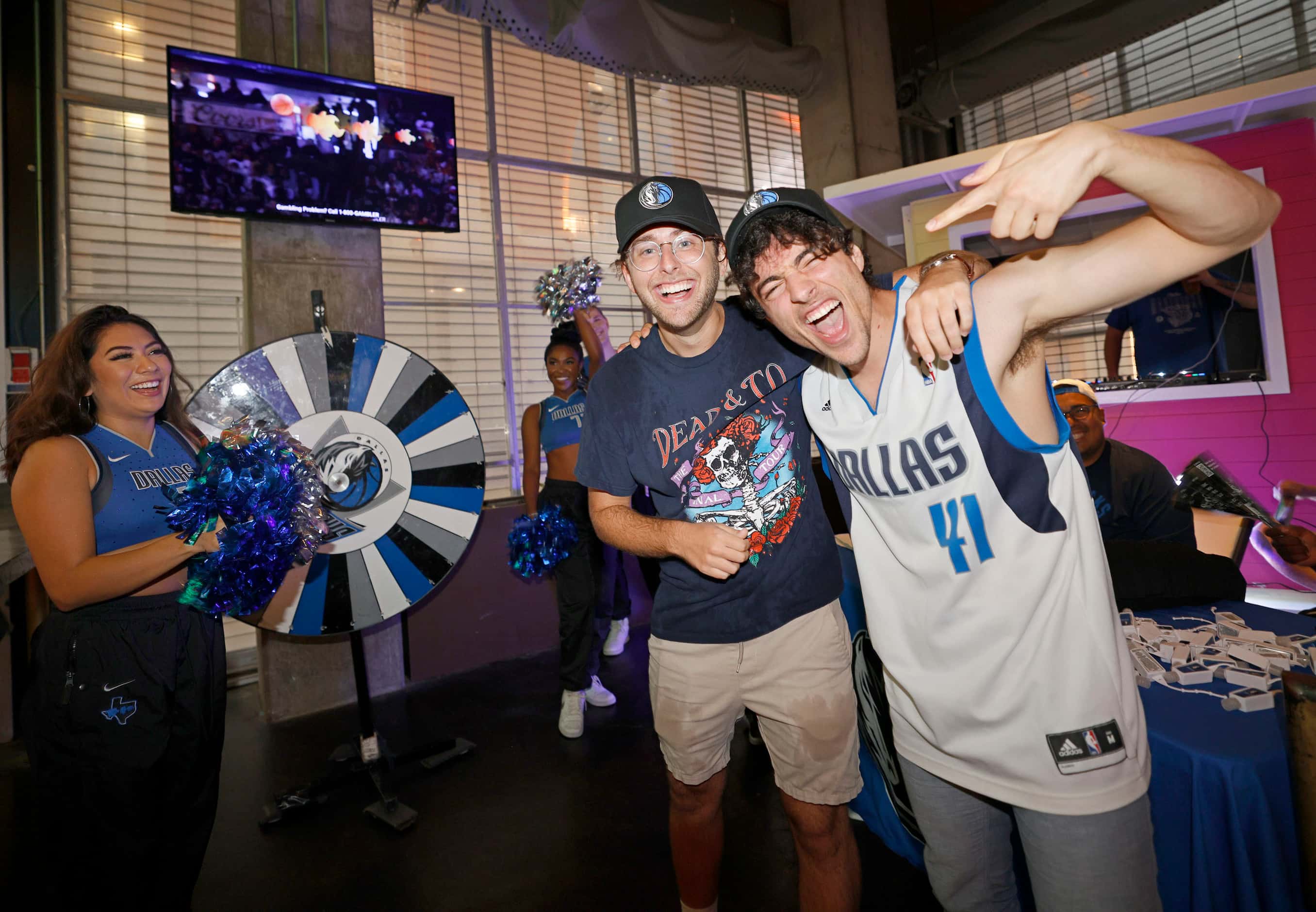 Dallas Mavericks fan Sammy Weyser of Dallas, right, poses for a photo with his friend Seth...