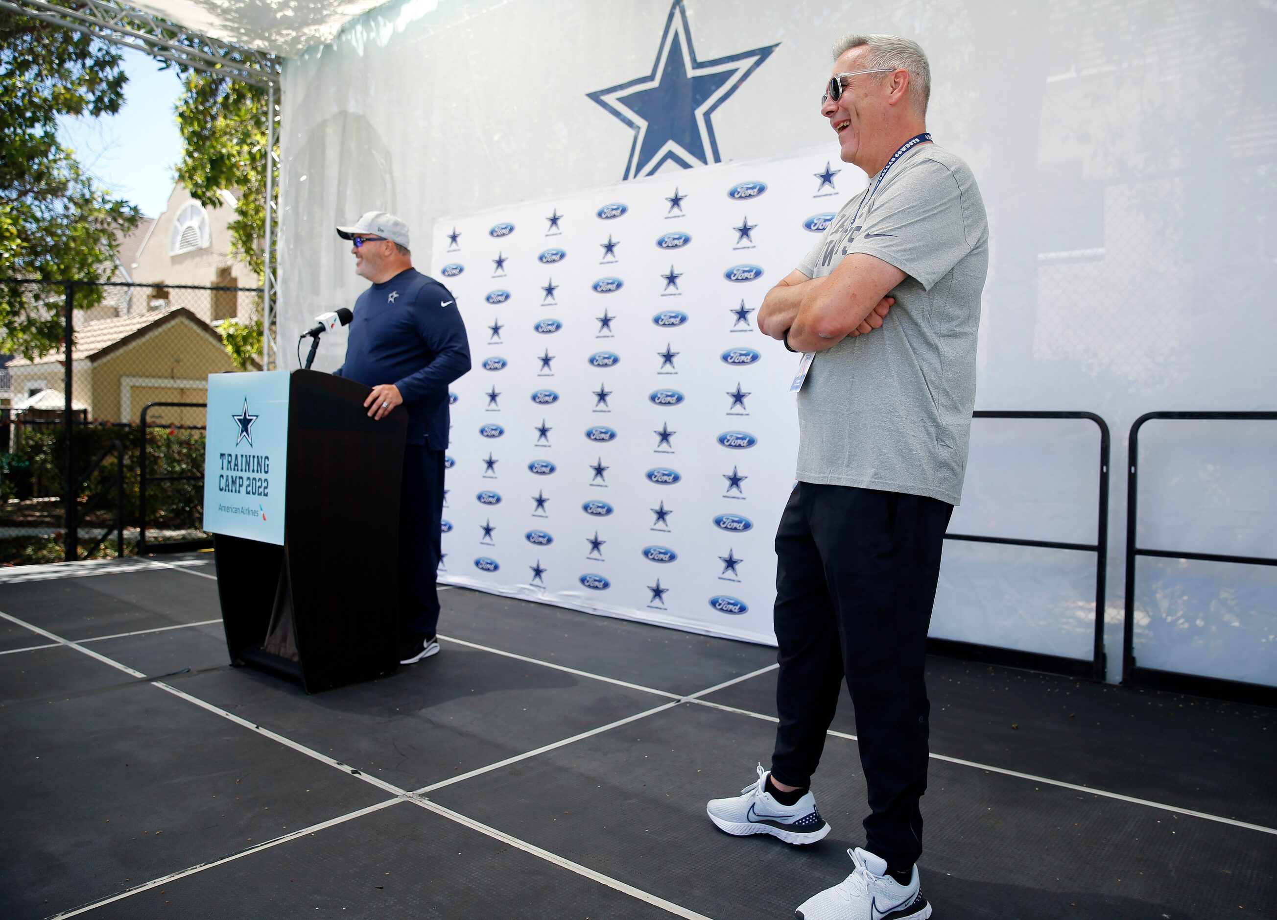 Dallas Cowboys new Sr. Vice President of Communications Tad Carper (right) laughs at a...