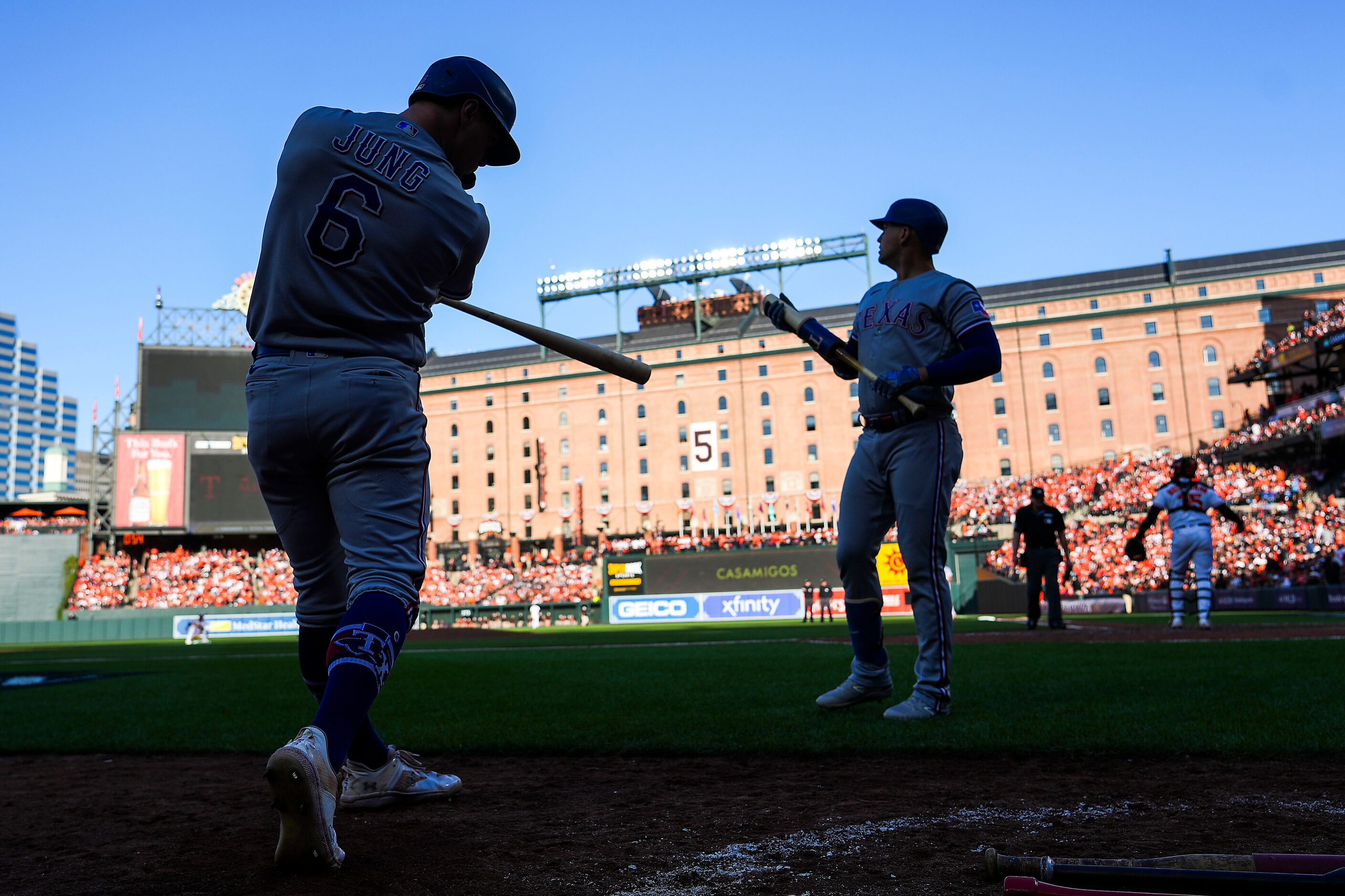 Texas Rangers third baseman Josh Jung (6) and first baseman Nathaniel Lowe (30) prepare to...