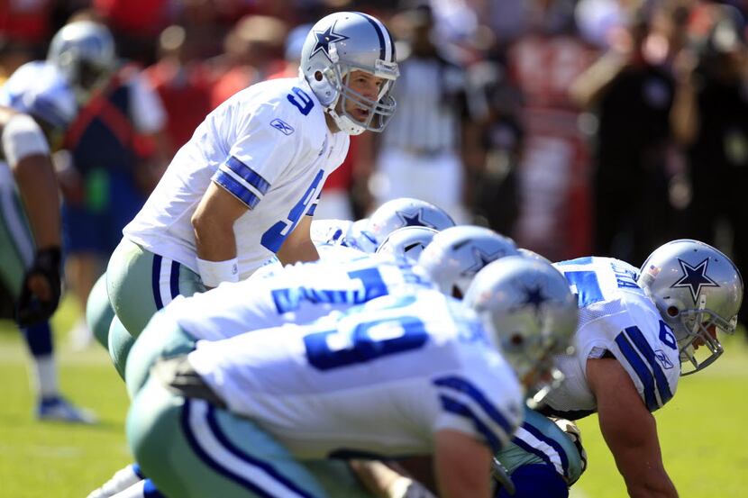 Dallas Cowboys quarterback Tony Romo (9) calls out the snap against the San Francisco 49ers...